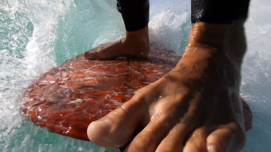 The author’s feet, five toes over the nose, the other five waiting for their moment. Frame from The Physics of Noseriding