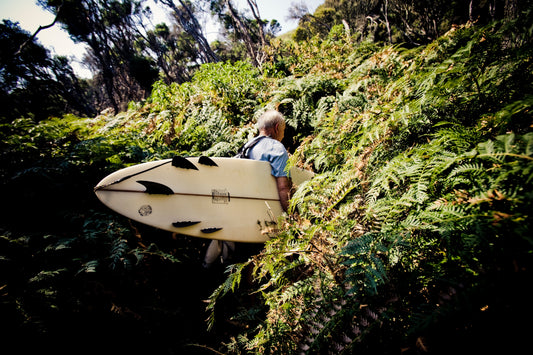 Opening image: Yvon disappearing coastward during his last trip to Australia, carrying a Bonzer shaped by his son, Fletcher. Photo Tim Davis